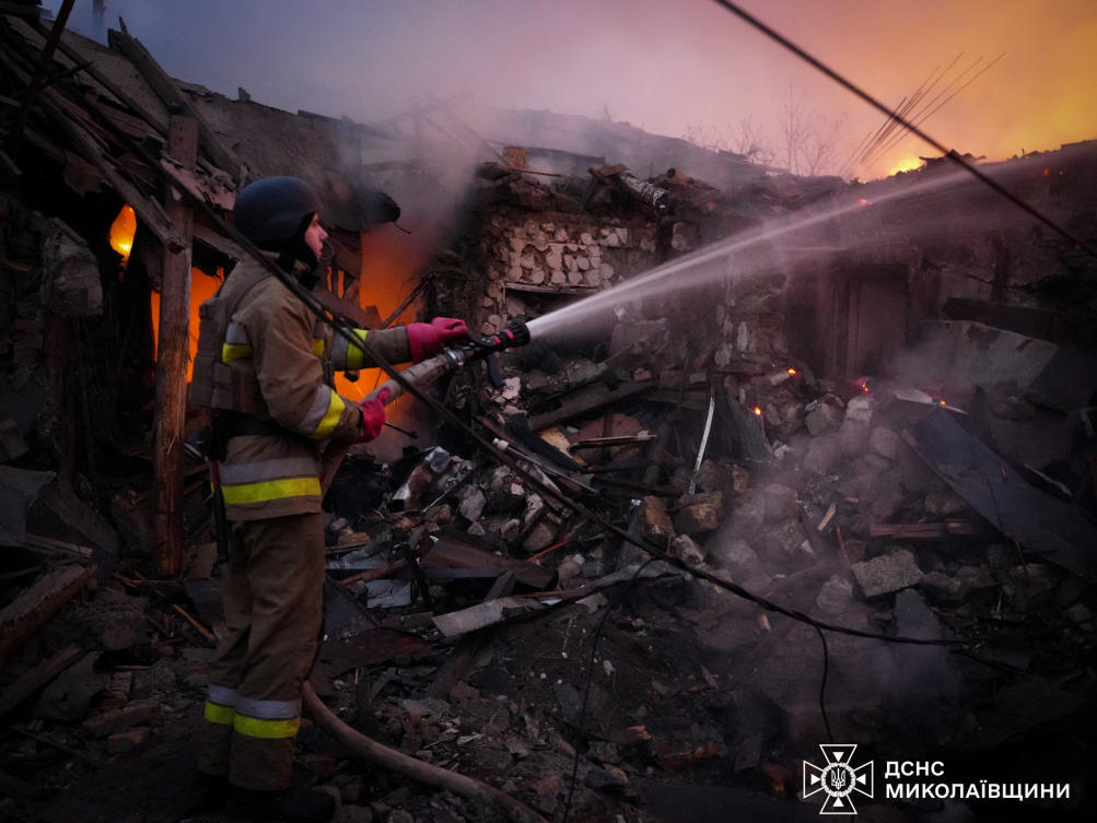 A firefighter works at the site of a residential house hit by a Russian drone strike on Nov. 17, 2024. (Handout via Reuters)