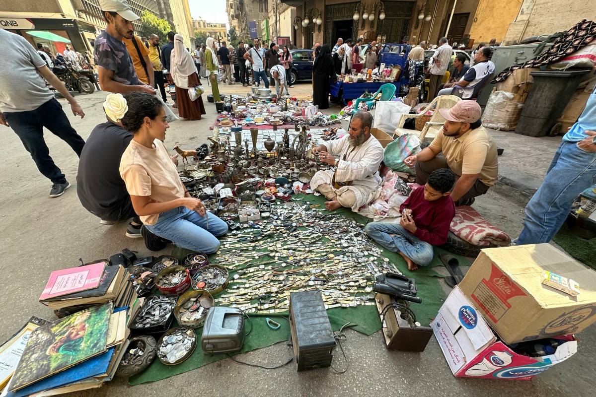 An Egyptian street vendor displays watches for sale at the Saturday market in downtown Cairo on October 5, 2024 (AFP)