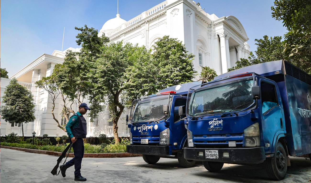A police personnel patrols around Bangladesh's International Crimes Tribunal (ICT) court in Dhaka on November 18, 2024. (AFP)