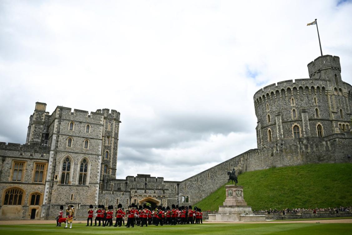 The Band of the Irish Guards, led by the Irish Guards’ Regimental Mascot, an Irish wolfhound named Seamus (Turlough Mor), march in the Windsor Castle’s Quadrangle during a ceremony where Britain's King Charles III presents New Colours to No 9 and No 12 Company The Irish Guards at Windsor Castle, west of London, on June 10, 2024. (File/AFP)