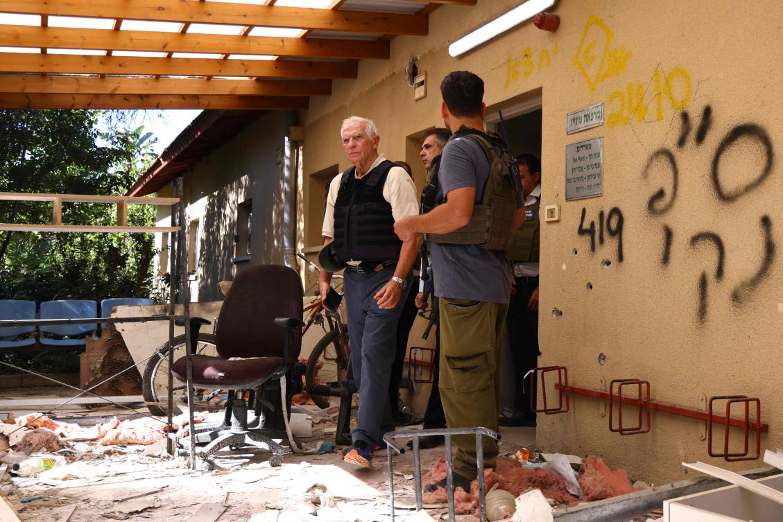 (FILES) European Union Foreign Policy Chief Josep Borrell (C) walks past debris during his visit to Kibbutz Beeri near the border with the Palestinian Gaza Strip on November 16, 2023, in the aftermath of an attack by Palestinian militants on October 7. (AFP)