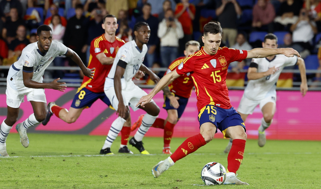 Spain's Zaragoza shoots from the penalty spot before scoring his side's third goal during a Nations League soccer match between Spain and Switzerland, Monday, Nov. 18, 2024. (AP)