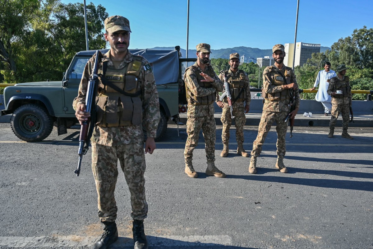 Pakistan Army soldiers stand guard in anticipation of former Prime Minister Imran Khan's supporters and activists amid the ongoing protests in Islamabad on October 6, 2024. (AFP)