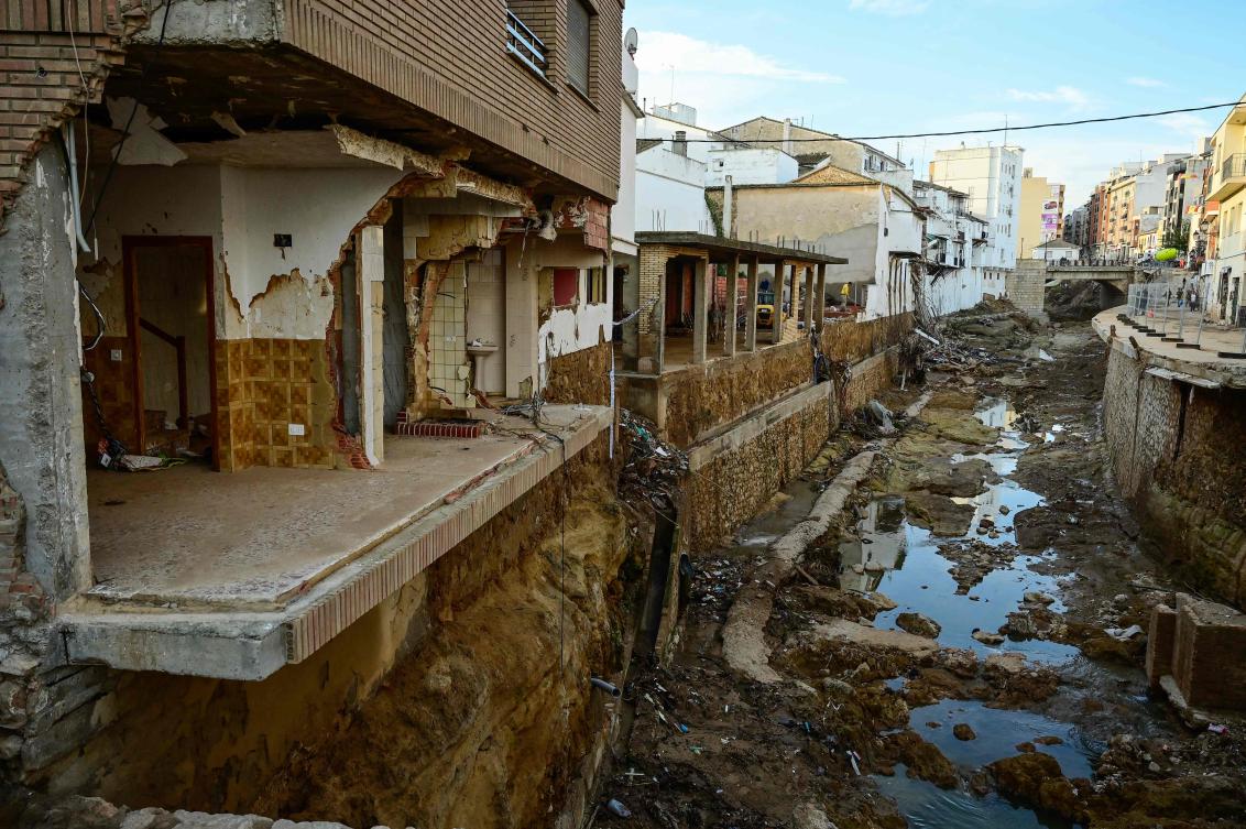 Flood damaged homes line the river in Chiva, in the region of Valencia, eastern Spain, in the aftermath of catastrophic deadly floods on November 19, 2024. October's catastrophic floods left at least 226 people dead, according to officials. (AFP)