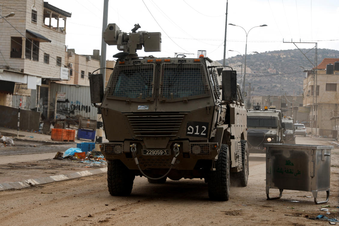 Israeli military vehicles maneuver during an Israeli raid in Qabatiya, near Jenin in the Israeli-occupied West Bank November 19, 2024. (REUTERS)