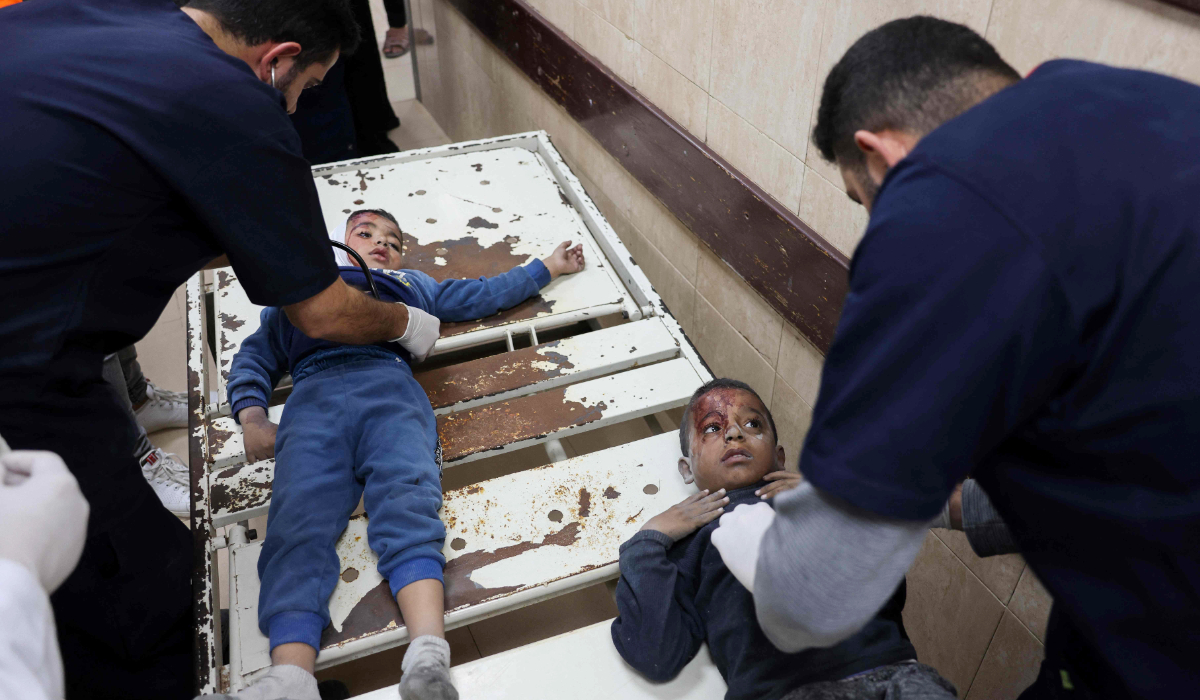 Medics tend to two wounded boys at al-Aqsa Martyrs Hospital in Deir Al-Balah in the central Gaza Strip on November 19, 2024, follwoing an Israeli strike in Bureij, amid the ongoing war between the Palestinian Hamas militant group and Israel. (AFP)
