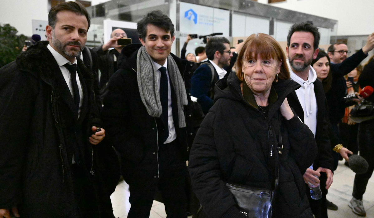 Gisele Pelicot (2ndR) leaves the courthouse with her son Florian (R) and her lawyers Antoine Camus (L) and Stephane Babonneau (2ndL) after a hearing in the trial of her former partner Dominique Pelicot accused of drugging her for nearly ten years and inviting strangers to rape her at their home in Mazan, a small town in the south of France, in Avignon, on November 19, 2024. (AFP)