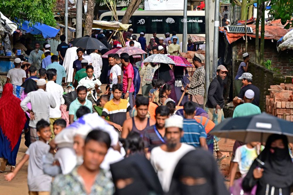 Rohingya refugees walk through a camp in Ukhia, Bangladesh, Sept. 9, 2024. (AFP)