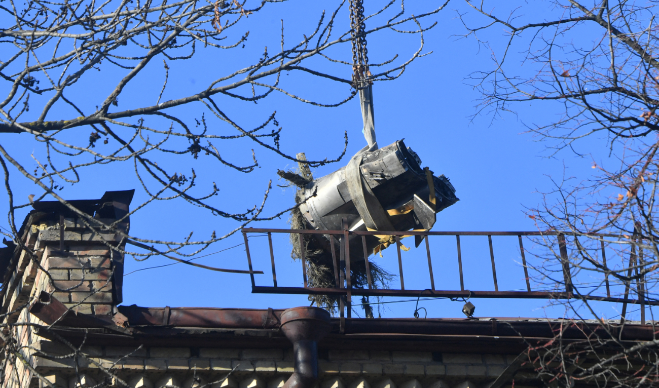 A hoisting crane removes a large fragment of a downed Russian hypersonic missile Zircon, after it struck a five-storey residential building in Kyiv on November 17, 2024. (AFP/File)