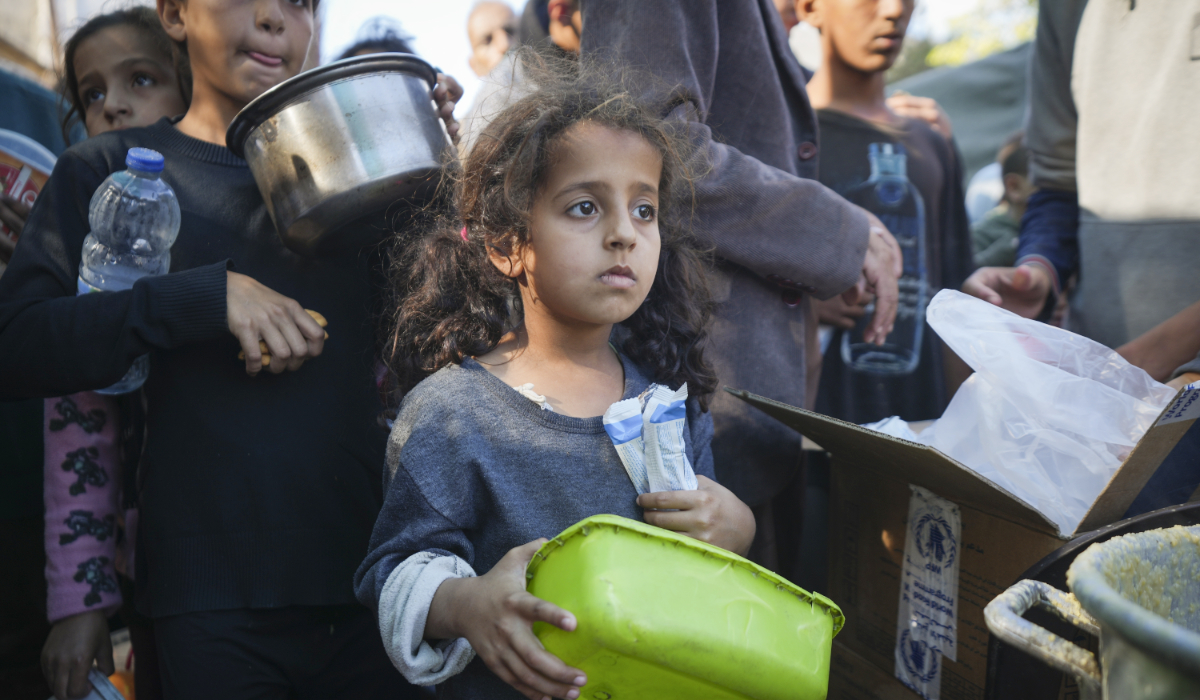 A Palestinian little girl queues for food in Deir Al-Balah, Gaza Strip, Monday, Nov. 18, 2024. (AP)