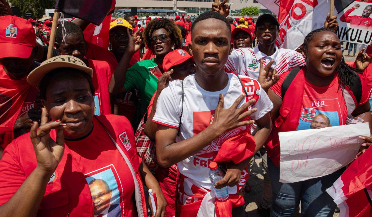 Supporters of the ruling Mozambique Liberation Front (FRELIMO) presidential candidate, Daniel Chapo, chant slogans during a march to celebrate the party's claimed electoral victory following weeks of protests in downtown Maputo on November 23, 2024. (AFP)