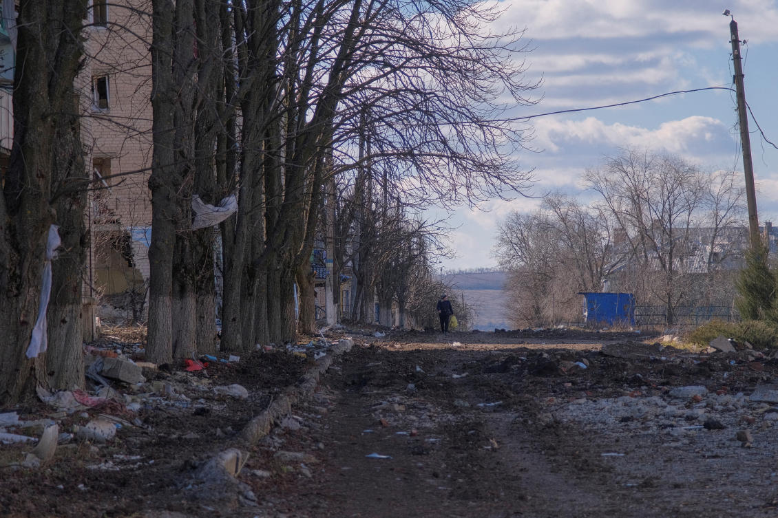 FILE PHOTO: A local resident walks along a damaged street, amid Russia's attack on Ukraine, in the town of Siversk, Donetsk region, Ukraine March 5, 2023. REUTERS/Alex Babenko/File Photo
