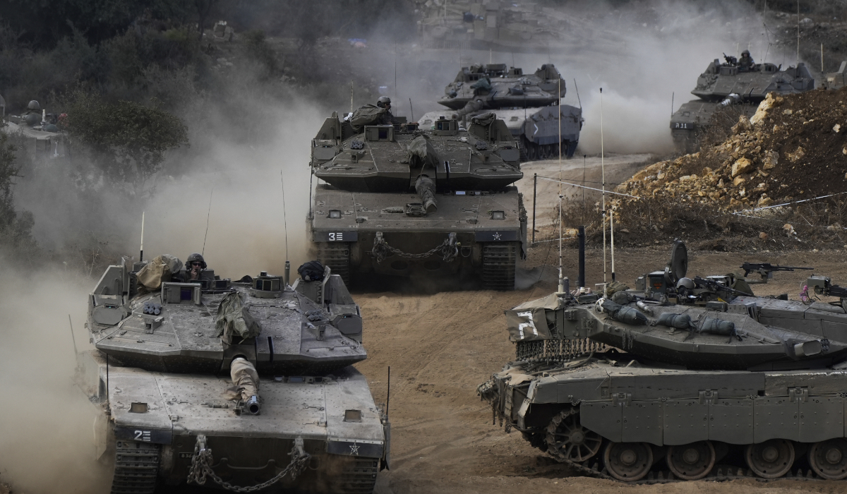Israeli army tanks maneuver in a staging area in northern Israel near the Israel-Lebanon border, Tuesday, Oct. 1, 2024. (AP)