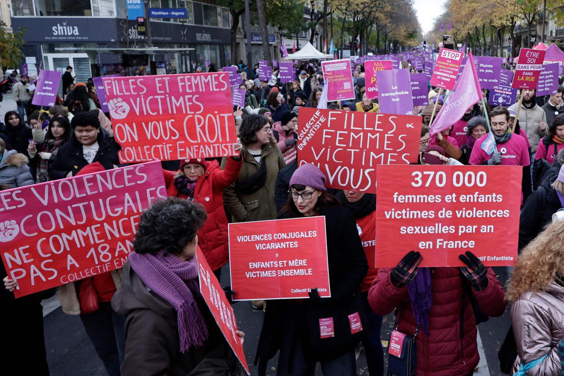 Demonstrators hold placards reading “conjugal violences don’t start at 18 years old” (L), “women and girls victims we believe you, collective Enfantiste,” “vicarious conjugal violences equals mother and children victims together” and “370 000 women and children victims of sexual violences per year in France” as they walk during a protest to condemn violence against women, called by feminist organizations two days prior to the international day for the elimination of violence against women, in Paris, on November 23, 2024. (AFP)