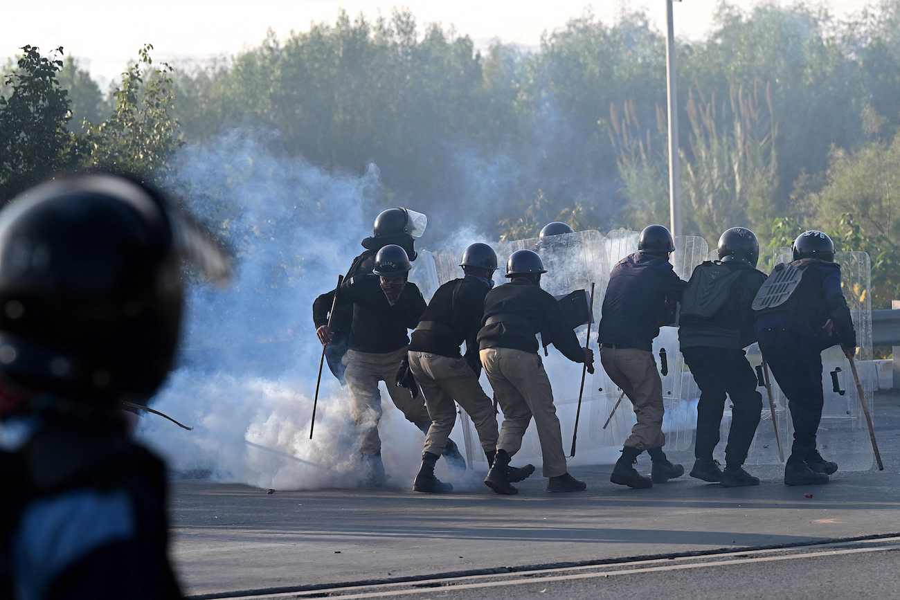 Policemen fire tear gas shells to disperse supporters of PTI party during a protest to demand the release of former prime minister Imran Khan, in Islamabad on November 26, 2024. (Reuters)