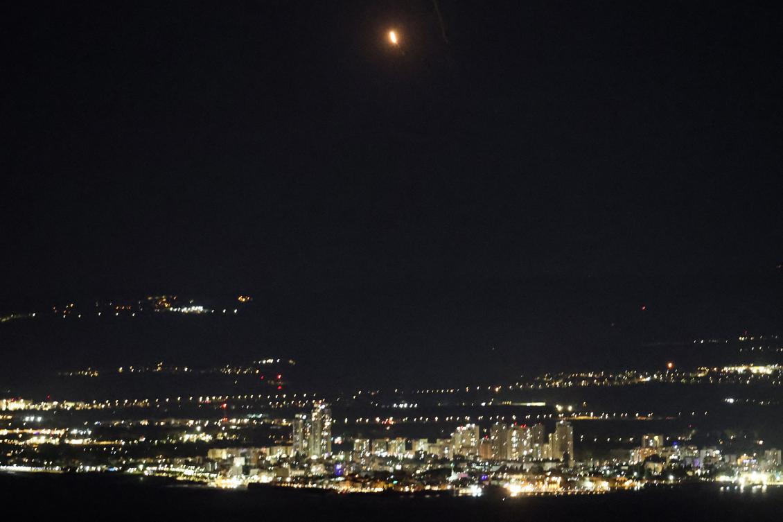 This picture taken from the Israeli port city of Haifa shows an explosion (top C) as Israel’s Iron Dome air defense system intercepts rockets fired from Lebanon over northern Israel, on Nov. 26, 2024. (AFP)