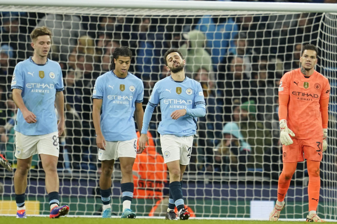 City players react after Feyenoord’s third goal. (AP)