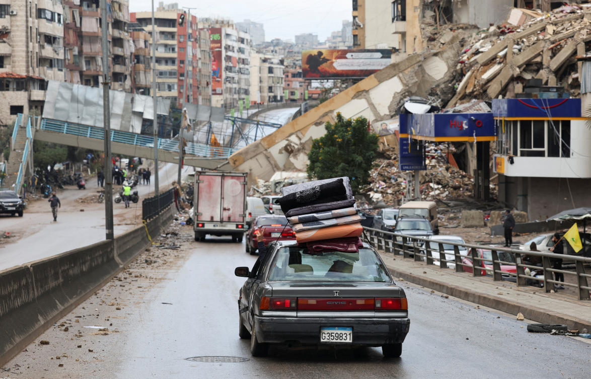 A vehicle transporting mattresses drives past a damaged pedestrian bridge in Beirut's southern suburbs, after a ceasefire between Israel and Hezbollah took effect, Lebanon November 27, 2024. (Reuters)