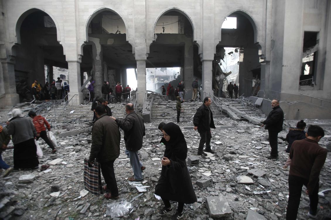 Palestinians inspect the damage at the site of an Israeli airstrike in the Nuseirat camp in central Gaza on November 27, 2024, amid the ongoing war in the Palestinian territory between Israel and Hamas. (AFP)