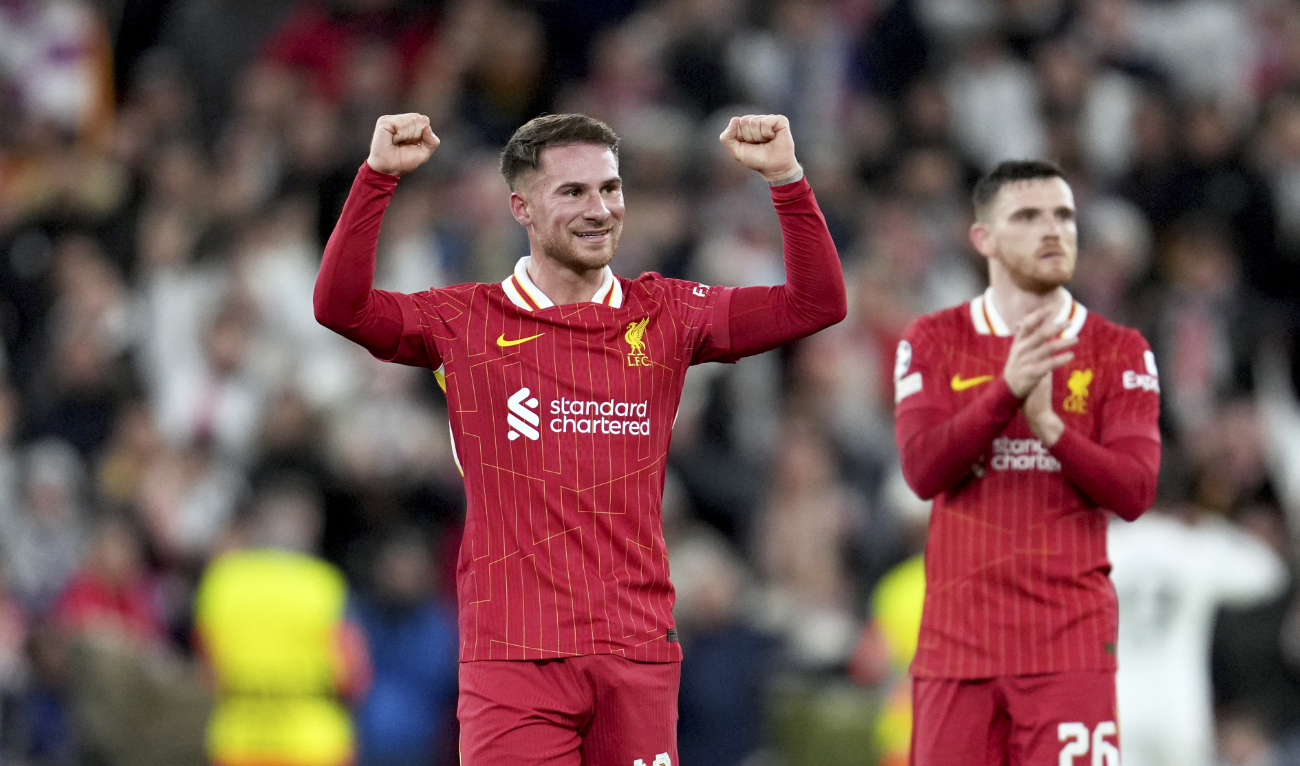 Liverpool's Alexis Mac Allister and Andrew Robertson, right, celebrate at the end of the Champions League opening phase soccer match between Liverpool and Real Madrid at Anfield Stadium, Liverpool, England, Wednesday, Nov. 27, 2024. (AP)