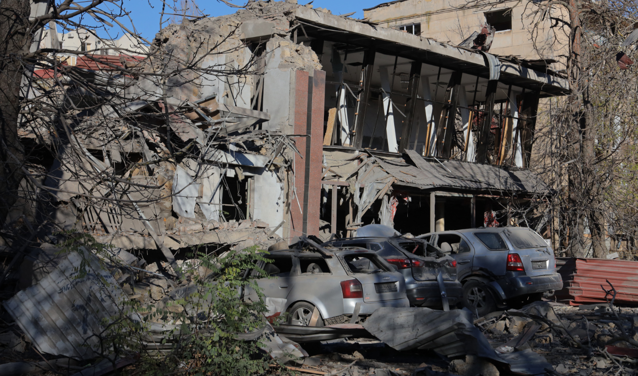This photograph taken on November 25, 2024 shows damaged cars in the courtyard of a destroyed building following a missile attack in Odesa. (AFP/File)