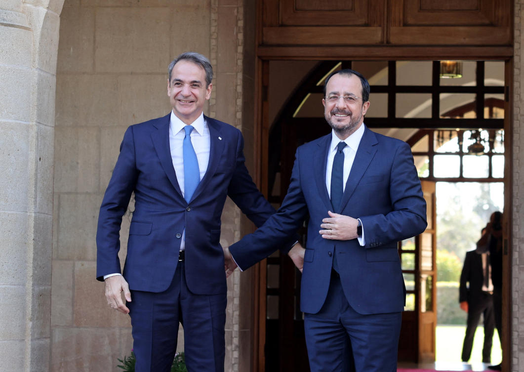 Cyprus’ President Nikos Christodoulides welcomes Greek Prime Minister Kyriakos Mitsotakis during a trilateral summit between Greece, Cyprus and Jordan at the Presidential Palace in Nicosia, Cyprus. (REUTERS)