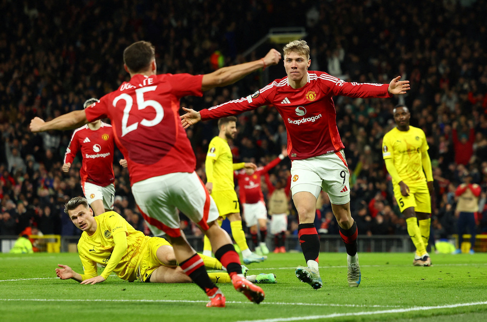 Manchester United’s Rasmus Hojlund (No. 9) celebrates scoring their third goal with Manuel Ugarte during the Europa League match against Bodo/Glimt at Old Trafford Thursday. (Reuters)
