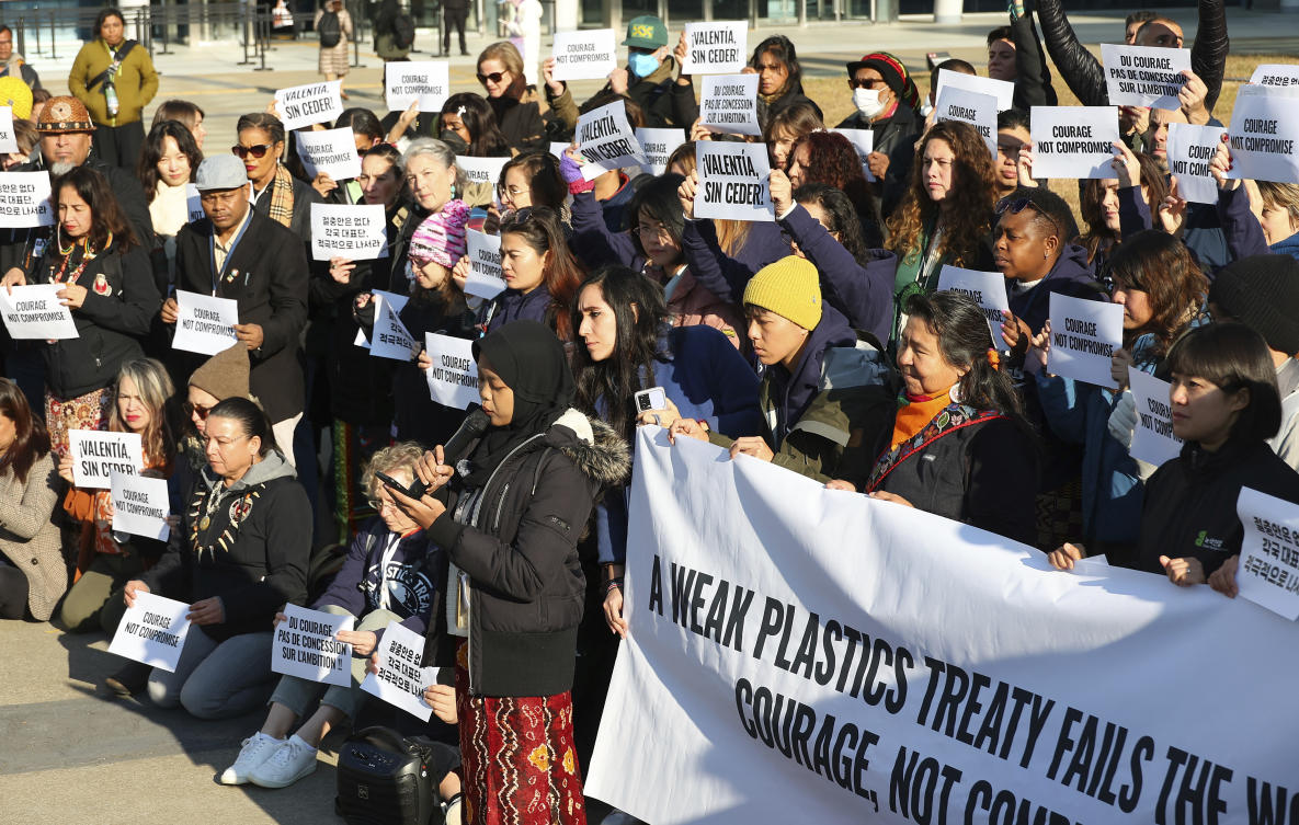 Environment activists call for a strong global plastics treaty outside of the venue for the fifth session of the Intergovernmental Negotiating Committee on Plastic Pollution in Busan, South Korea on Nov. 29, 2024. (Yonhap via AP)