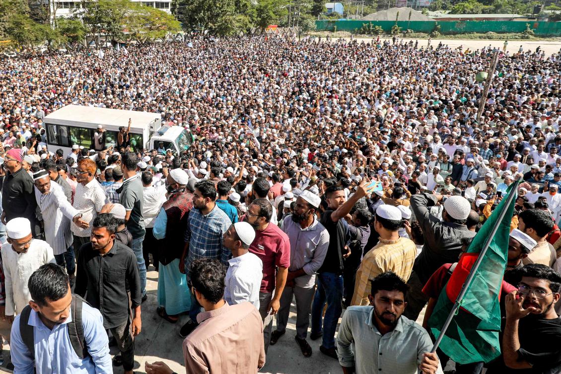 People gather during the funeral ceremony of public prosecutor Saiful Islam Alif in Chittagong on Nov. 27, 2024. (AFP)