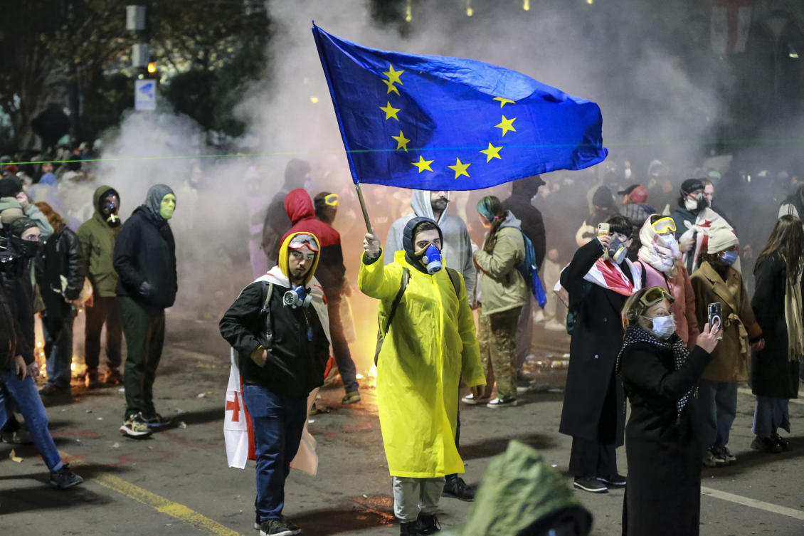 A protester waves an European Union flag during a rally outside the parliament to protest the government’s decision to suspend negotiations on joining the European Union for four years in Tbilisi, Nov. 30, 2024. (AP)
