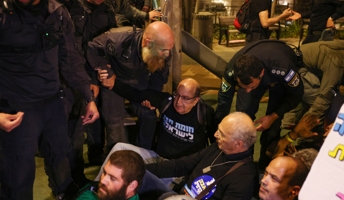 Former Defence Minister Moshe Yaalon joins anti-government protesters and supporters of Israelis held hostage in Gaza during a sit-in calling for their release near the prime minister's residence in Jerusalem on October 28, 2024. (AFP)