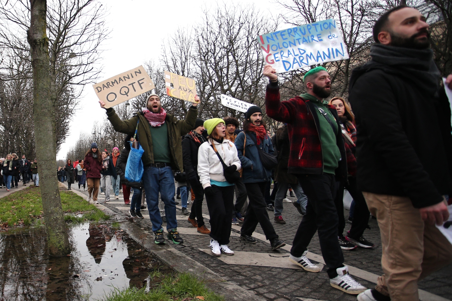 Demonstrators hold placards as they take part in a rally against France’s recently adopted law on immigration. Jan. 21, 2024-AFP