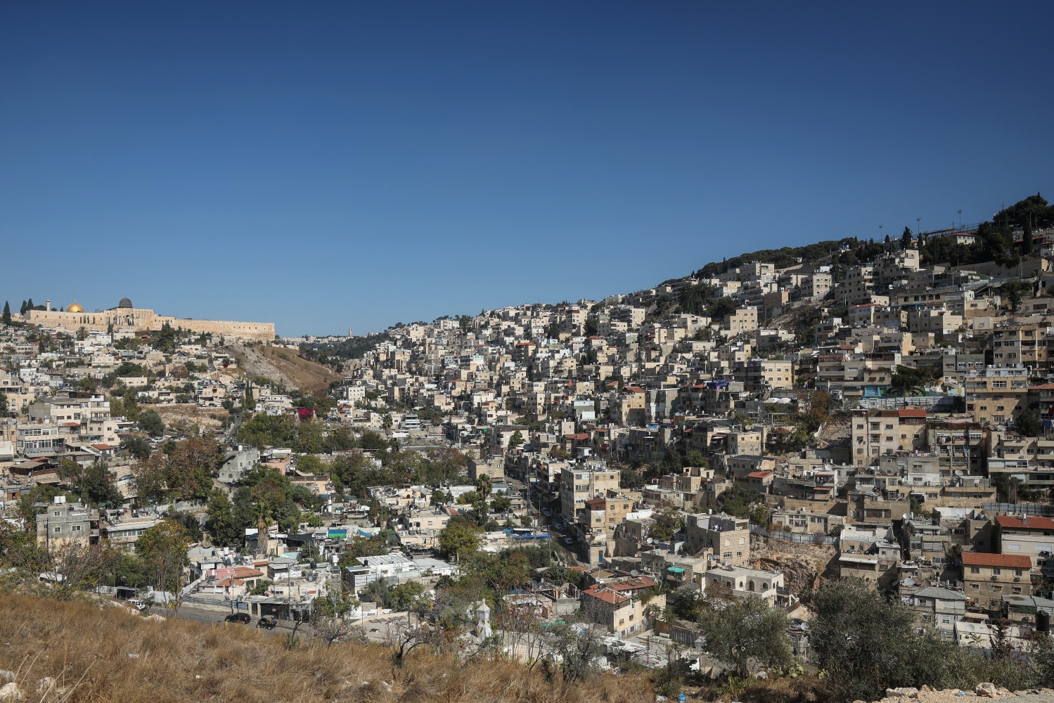 Palestinian homes and centers are being demolished and replaced by Jewish settlers and institutions (File/AFP)