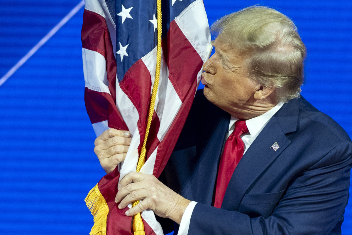 Donald Trump kisses the flag during the CPAC 2024 at National Harbor, in Oxon Hill, Maryland on Feb. 24, 2024. (AP/File)