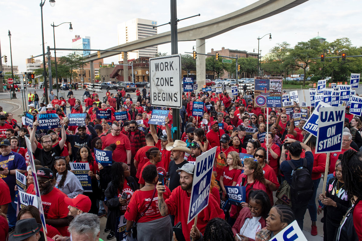 Auto factory workers march in downtown Detroit during a strike on Sept. 15, 2023. (AFP)