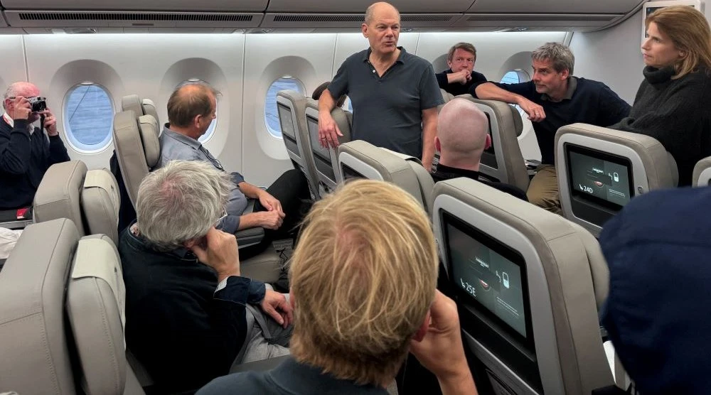 Olaf Scholz talks to journalists aboard the government plane after the G20-Summit in Rio de Janeiro, Nov. 19, 2024. (Reuters)