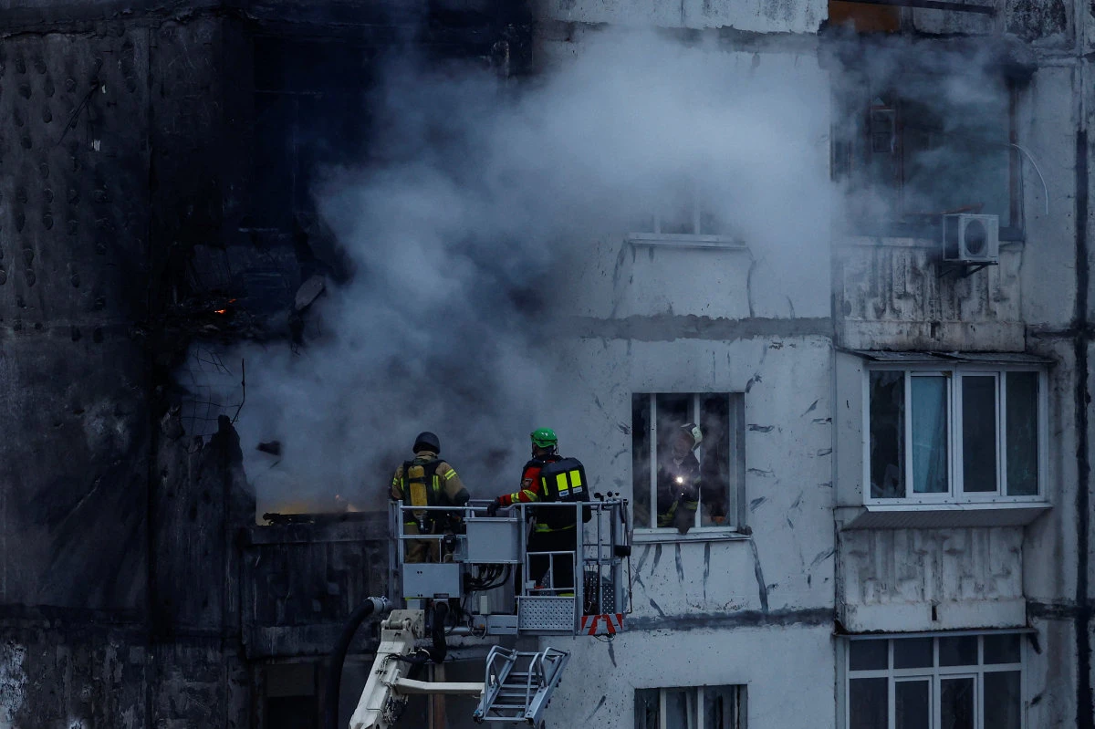 Firefighters work at an apartment building damaged by a Russian drone strike in Kyiv, Ukraine, on November 2, 2024. (REUTERS)