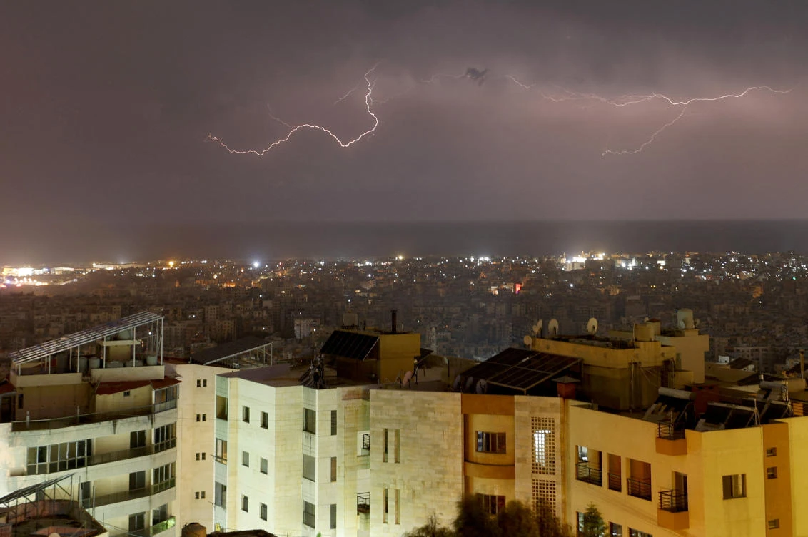 A lightning flash gleams over Beirut's southern suburbs, amid the ongoing hostilities between Hezbollah and Israeli forces, as seen from Baabda, Lebanon, November 2, 2024. (Reuters)