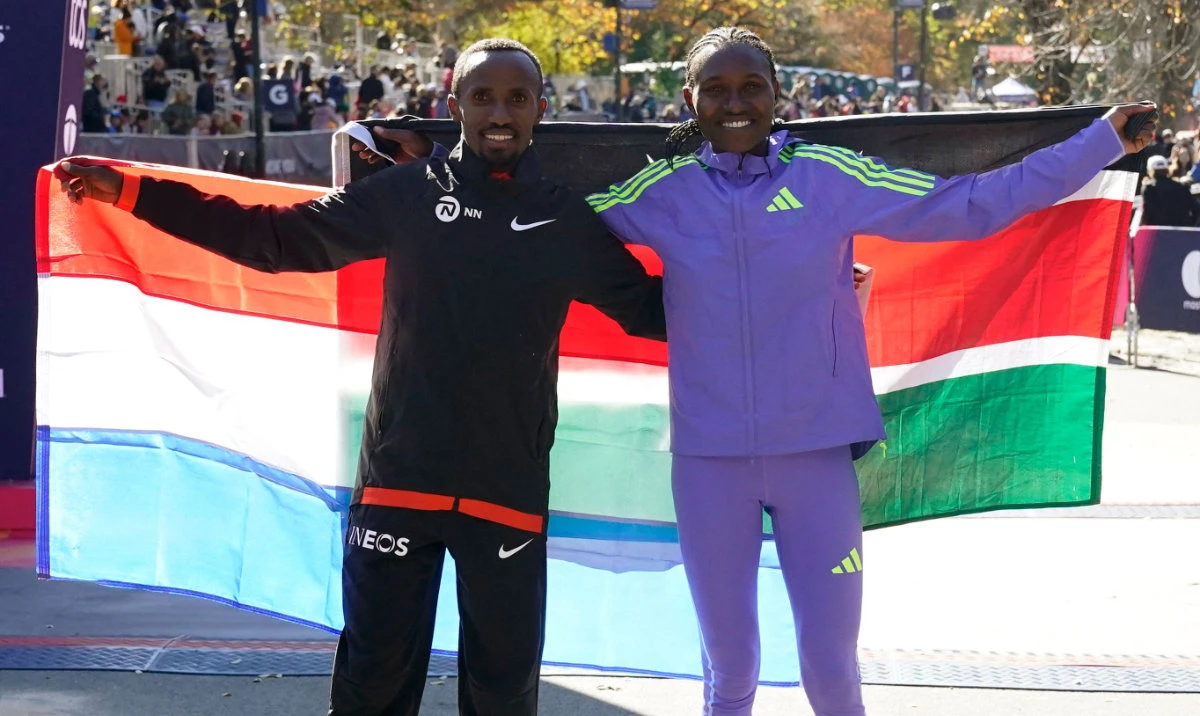 Professional men’s division winner Abdi Nageeye (L) of the Netherlands and professional women’s division winner Sheila Chepkirui of Kenya pose after the New York Marathon in New York City on Nov. 3, 2024. (AFP)