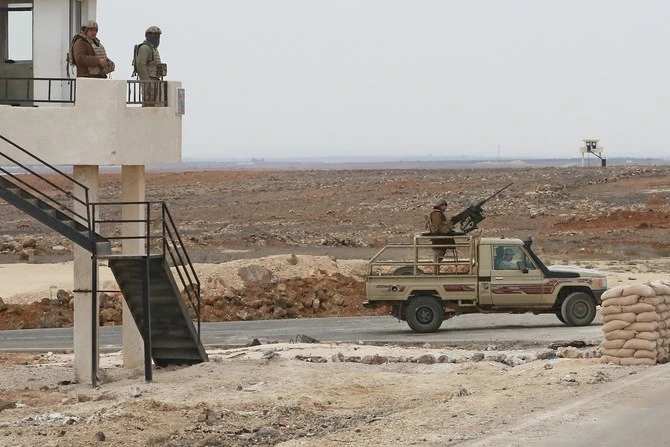 A picture taken during a tour origanized by the Jordanian Army shows soldiers patrolling along the border with Syria to prevent trafficking, on February 17, 2022. (AFP)