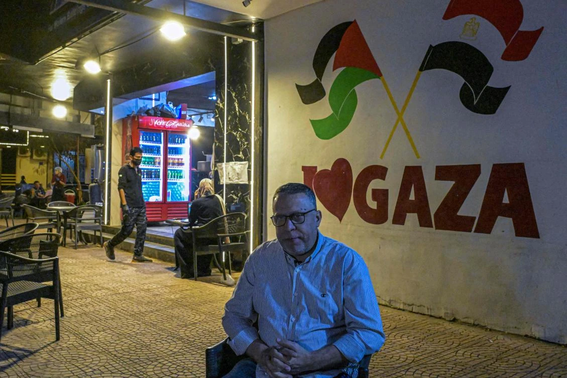 Less than four months after fleeing with his family to neighbouring Egypt from the besieged Palestinian territory, Palestinian Bassem Abu Aoun opened his eatery, one of the many cafes, falafel joints, shawarma spots and sweets shops being started by newly arriving Palestinian entrepreneurs in the area, in Cairo's Nasr City neighbourhood. (AFP)