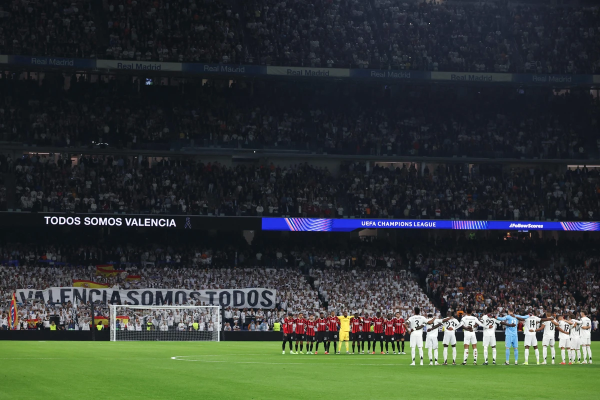 Real Madrid and AC Milan pay tribute to victims of deadly Valencia floods in Champions League match