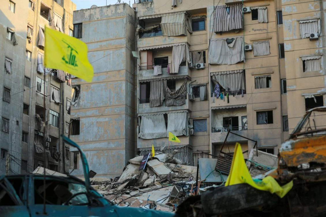 This picture taken during a media tour organised by Hezbollah press office on November 5, 2024, shows Hezbollah flags placed on the site of an Israeli airstrike that targeted earlier last week Beirut's southern suburbs al-Jamous neighbourhood. (File/AFP)