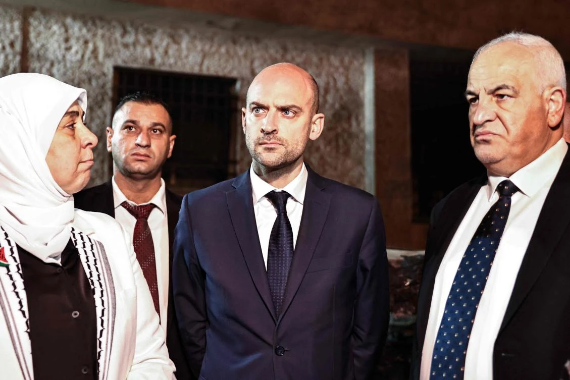 France’s Minister for Europe and Foreign Affairs Jean-Noel Barrot (C), Palestinian Interior Minister Ziad al Reeh (R) and Governor of Ramallah Laila Ghannam (L) visit an area where Israeli settlers reportedly set fire to a car and a building in Ramallah on Nov. 7, 2024. (AFP)