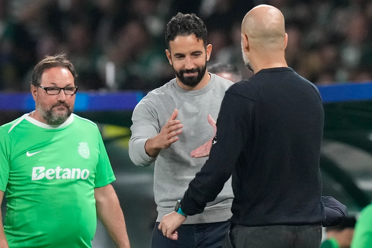 Sporting Lisbon's head coach Ruben Amorim, left, shakes hand with Manchester City's head coach Pep Guardiola after the UEFA Champions League opening phase match between Sporting and Manchester City in Lisbon, Portugal. (AP)