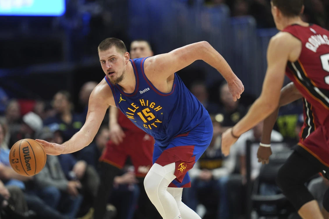 Nikola Jokic had 30 points, 14 assists and 11 rebounds for his third straight triple-double to lead the Denver Nuggets past the Miami Heat 135-122 Friday night. (AP)