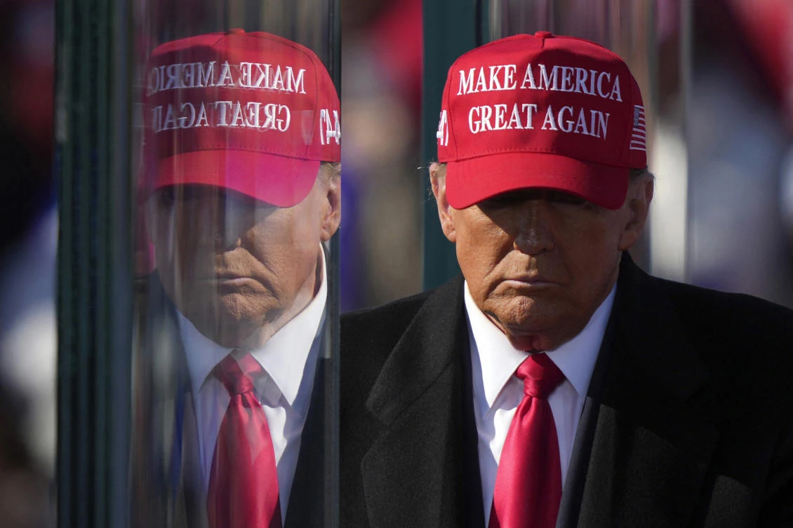 Republican presidential nominee former President Donald Trump is reflected in the bullet proof glass as he finishes speaking at a campaign rally in Lititz on Nov. 3, 2024. (AP)
