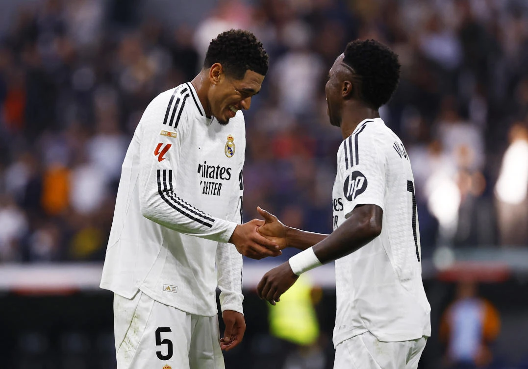 Real Madrid’s Vinicius Junior celebrates scoring their fourth goal with Jude Bellingham and completes his hat-trick during their LaLiga match against Osasuna at Santiago Bernabeu, Madrid, on Nov. 9, 2024. (Reuters)