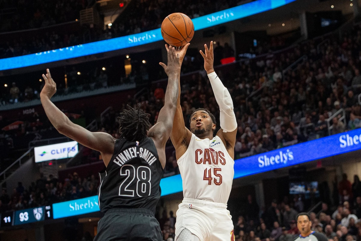 Cleveland Cavaliers’ Donovan Mitchell shoots over Brooklyn Nets’ Dorian Finney-Smith during the second half of an NBA basketball game in Cleveland Saturday. (AP)