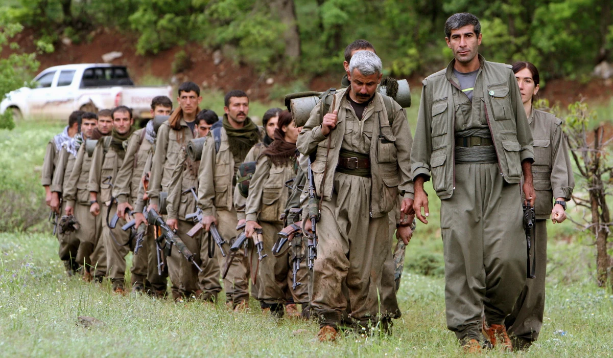 A group of armed Kurdish fighters from the Kurdistan Workers Party (PKK) enter northern Iraq in the Heror area, northeast of Dahuk, 260 miles northwest of Baghdad, Iraq. (AP file photo)
